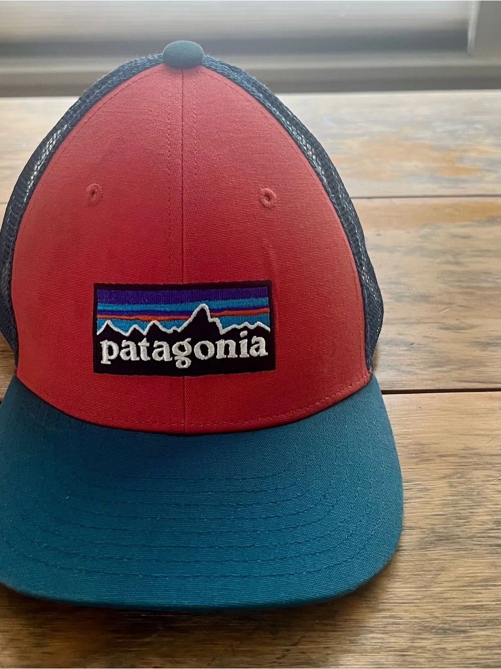 Patagonia women’s Two-Tone Red and Teal Mesh Trucker Hat